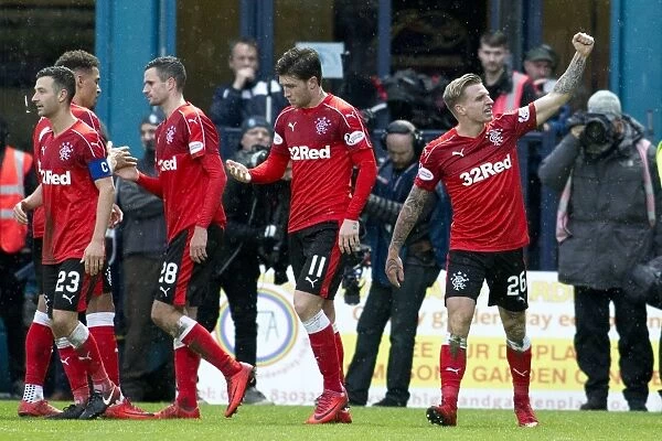Rangers' Jason Cummings Scores and Celebrates with Team Mates against Ross County in Ladbrokes Premiership at Global Energy Stadium