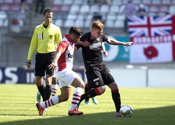 Rangers Lewis Macleod Fights for Ball in Intense FC Emmen vs Rangers Soccer Match (0-1)