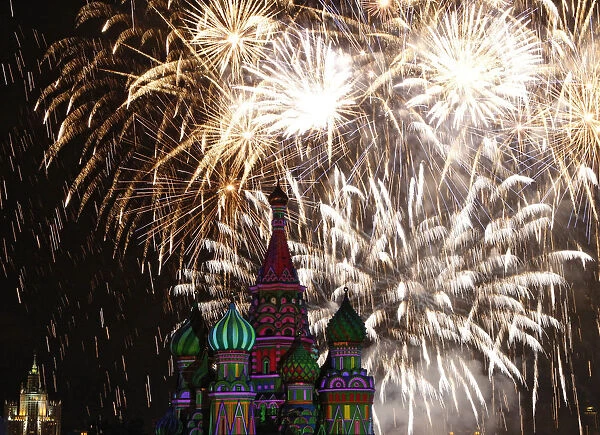 Fireworks explode above St. Basils cathedral during the Spasskaya Tower international
