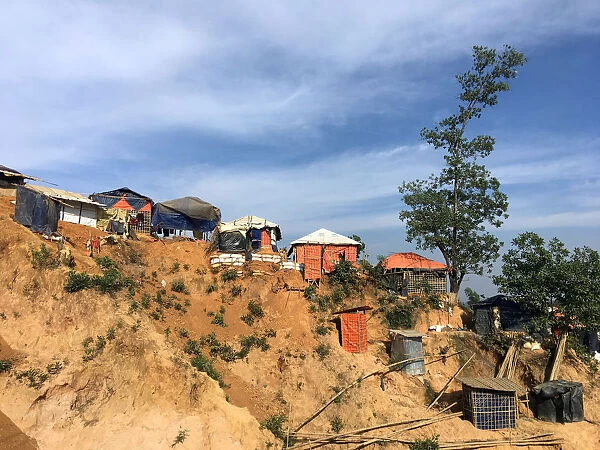 Shacks cling to a landslide-prone hill in the Balukhali camp for Rohingya refugees in