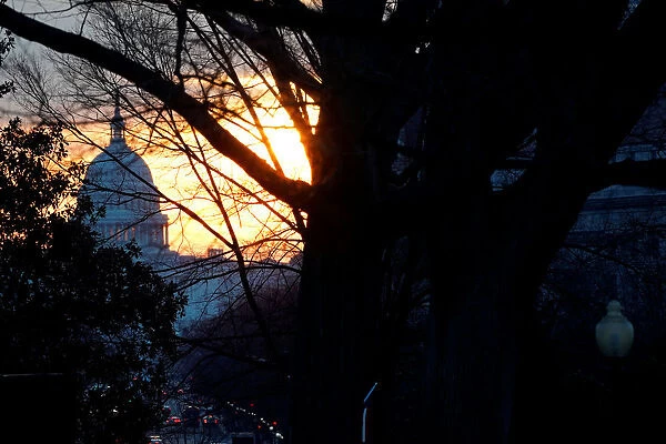 The sun rises over the U. S. Capitol in Washington