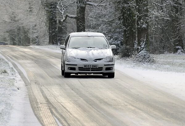 2003 Nissan Almera driving on icy road in winter