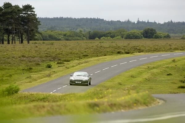 2005 Aston Martin DB9 on winding country road