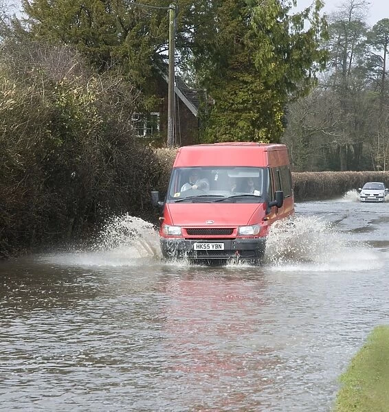 Van splashing through flood