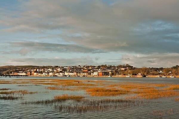 View across estuary with receeding tide towards town on sunny winter morning, River Torridge, Bideford, North Devon