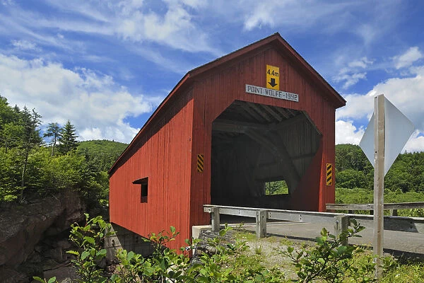 Canada, New Brunswick, Fundy National Park. Red covered bridge at Point Wolfe. Credit as