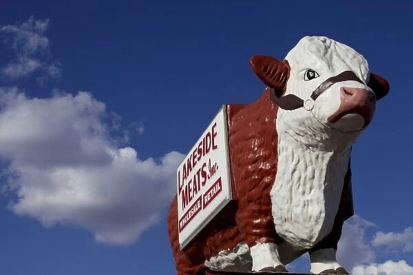 Carlsbad, New Mexico, United States. Vintage large cow sculpture atop meat market