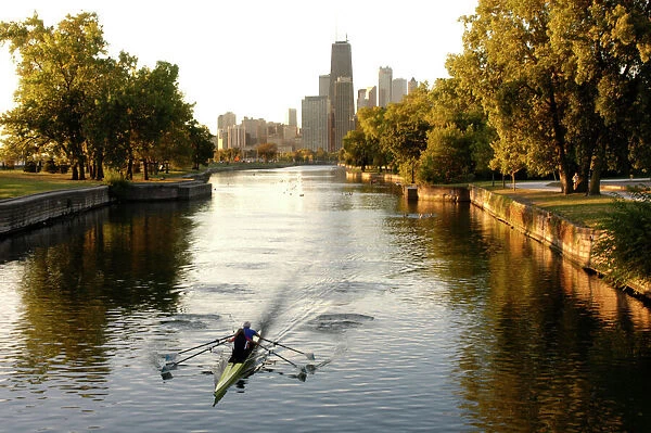 Chicago, Illinois, Rowers in Lincoln Park lagoon at dawn. Chicago, Illinois, USA
