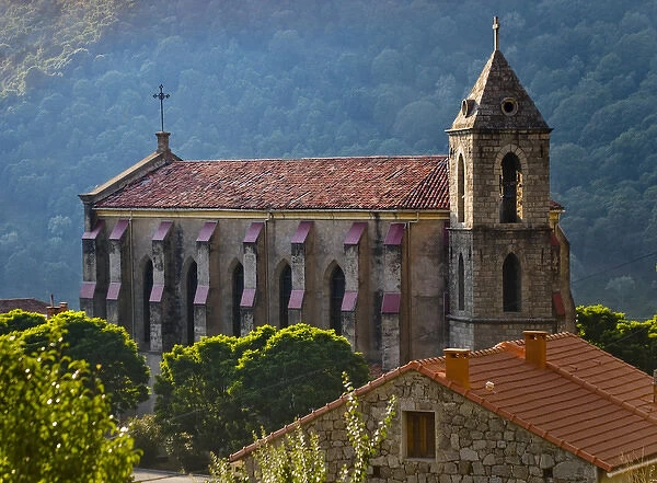 Corsica. France. Europe. Church & house in mountain village of Zicavo