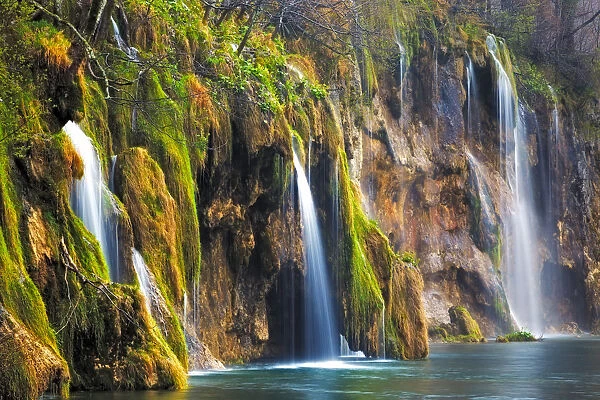 Europe, Croatia, Plitvice Lakes National Park. Waterfalls into stream. Credit as