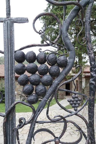 Georgia, Mtskheta. Decorative grapes on a metal fence