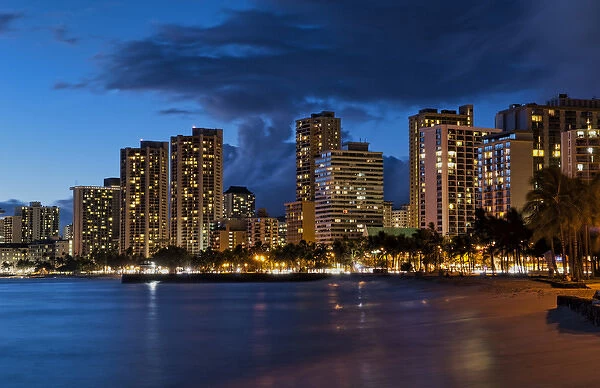 Hawaii Honolulu twilight of Waikiki Beach at night with colorful sky in Oahu
