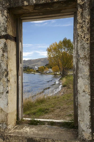 Looking through window of derelict building to Lake Dunstan and Old Cromwell Town
