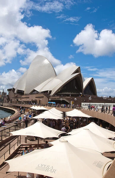 Restaurant and umbrellas in area of famous Sydney Opera House in harbour in New South