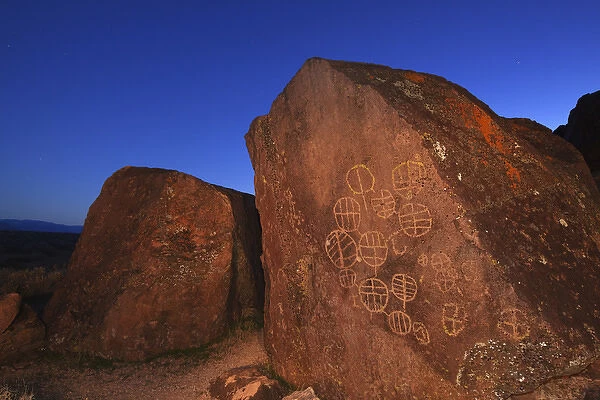 USA, California, Owens Valley, Bishop. Illuminated rock with petroglyphs. Credit as