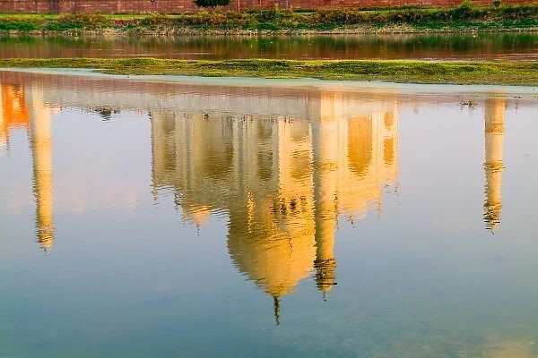 World famous Taj Mahal temple reflection at sunset from Yamuna River in town of Agra India