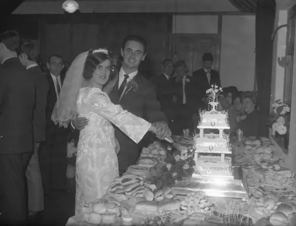 Bride and Groom Cutting Wedding Cake Art Prints, Posters