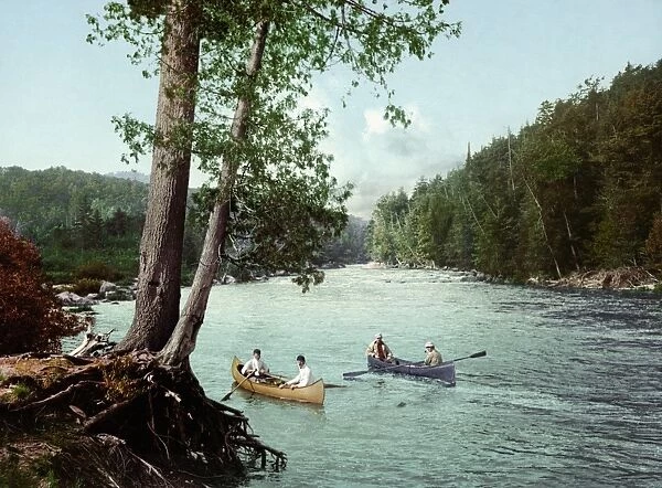 ADIRONDACKS, c1902. Canoeing in a stream in the Adirondack Mountains, New York