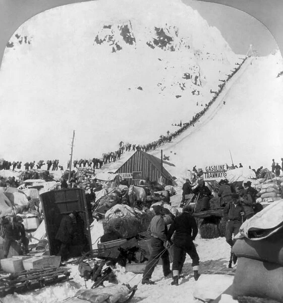 ALASKA: MINERS, c1898. Miners climbing a mountain, bound for the Klondike gold fields in Alaska
