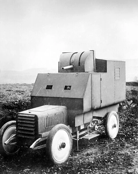 An armored car, fashioned with a balloon gun. Photograph, c1909