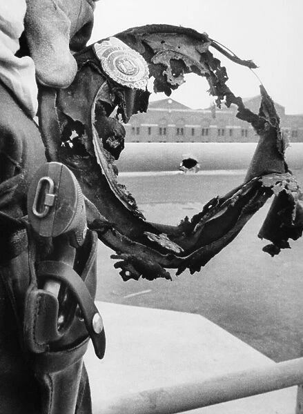 ATTICA PRISON RIOT, 1971. The burned hat of a prison guard frames a bullet hole in the railing surrounding cell block D of Attica Correctional Facility in Attica, New York, following the inmate riot on 13 September 1971