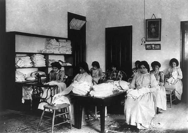 CARLISLE SCHOOL, c1901. Clothes mending class at the Carlisle Indian School in Carlisle