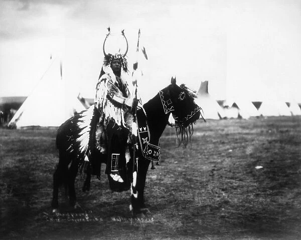 CAYUSE CHIEF, c1900. David Young, a Cayuse Native American chief, riding a horse