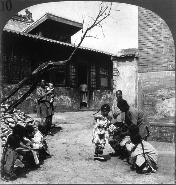CHINA: CHILDREN, c1929. A group of children playing a game in China. Stereograph, c1929