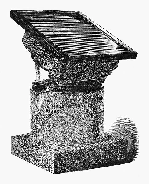 EGYPT: ROSETTA STONE. Display table for the Rosetta Stone, inscribed c196 B. C. Line engraving, 19th century