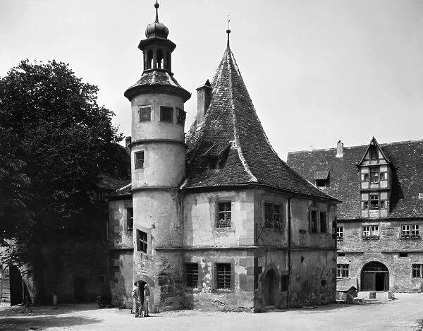 GERMANY: ROTHENBURG. Hegerechterhaus, part of the wall that surrounds the medieval town of Rothenburg ob der Tauber, Bavaria, Germany. Photograph, c1960s