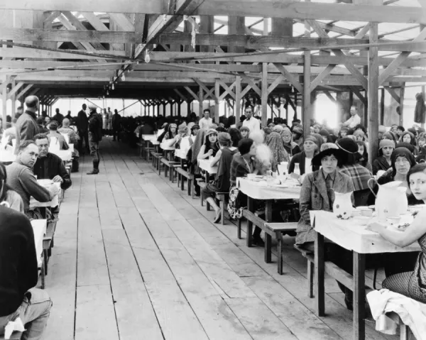 HOLLYWOOD STUDIO, 1923. Cast and crew at lunch at Paramount studios during the production of the silent film The Ten Commandments directed by Cecil B. DeMille, 1923