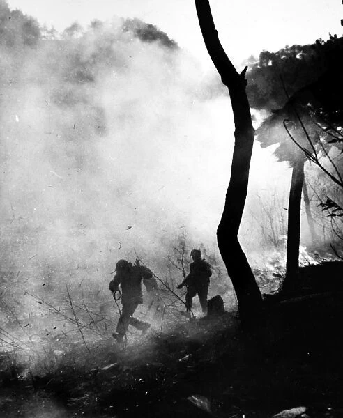 KOREAN WAR: COMBAT, 1951. Marines from the First U. S. Division on a battlefield in Korea, May 1951