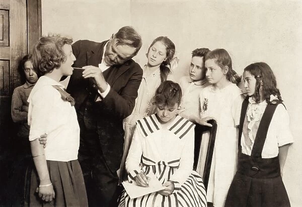 MEDICAL EXAM, 1917. School children receiving throat exams at Washington School in Lawton