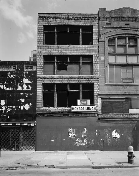 MICHIGAN: DETROIT, c1980. Abandoned storefronts along Monroe Street in Detroit, Michigan