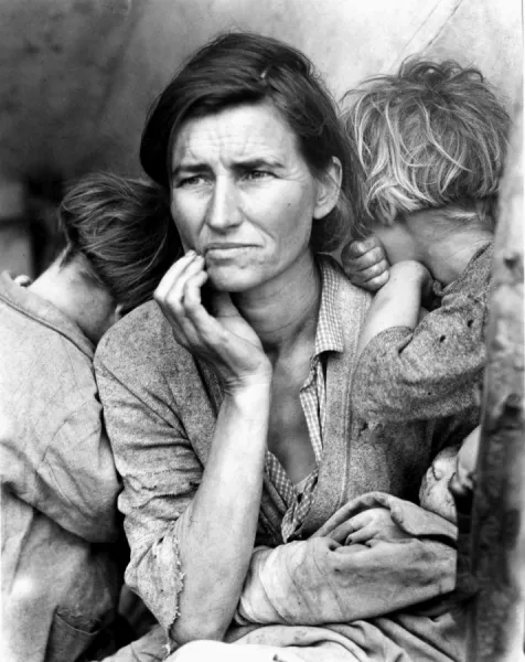 MIGRANT MOTHER, 1936. Florence Thompson, a 32-year-old migrant worker and mother of seven, with her children in a camp for migrant workers in Nipomo, California, 1936. Part of the Migrant Mother series by Dorothea Lange, 1936