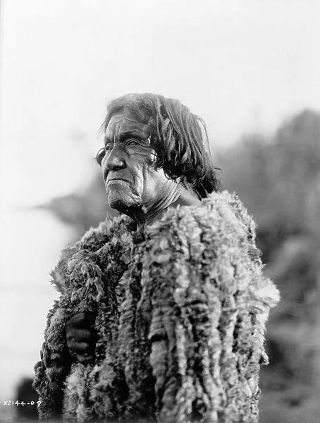 MOHAVE MAN, 1907. Portrait of a Mohave man wearing a rabbit skin robe. Photograph by Edward S
