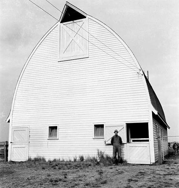 OREGON: BARN, 1939. A farmer from Nebraska with his new barn on the Yamhill farms
