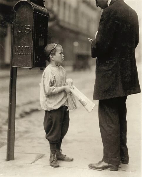 PHILADELPHIA: NEWSBOYS, 1910. A seven-year-old newsboy selling newspapers in Philadelphia