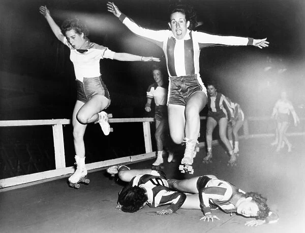 ROLLER DERBY, 1950. Women competing in a roller derby competition. Photograph by Al Aumuller