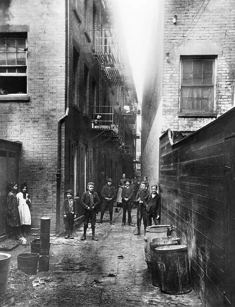 STREET URCHINS, c1888. Children in Mullens Alley, off Cherry Street in New York City
