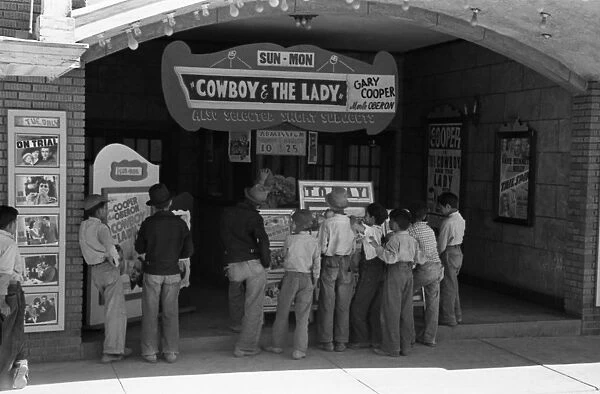 TEXAS: MOVIE THEATRE, 1939. Children in front of a movie theatre, Alpine, Texas