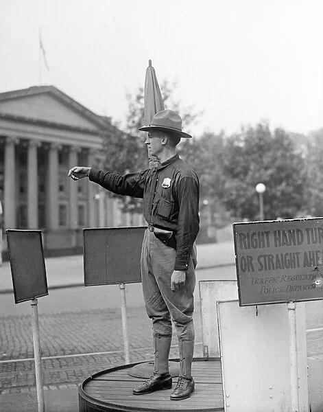 TRAFFIC COP, 1918. Army officer directing traffic at the U. S. Treasury Department, Washington, D
