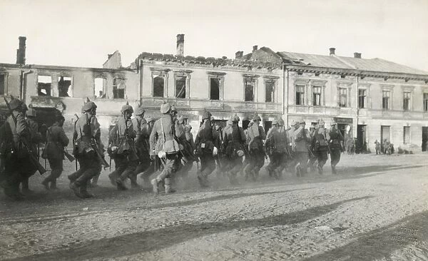WORLD WAR I: GERMAN TROOPS. German troops marching through a city in Russian Poland