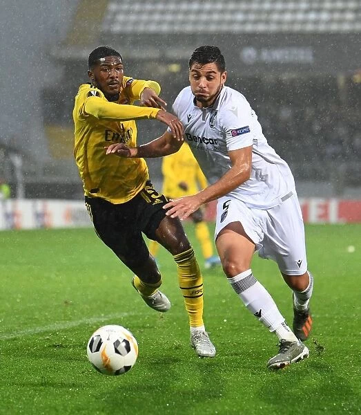 Arsenal's Ainsley Maitland-Niles Faces Off Against Vitoria Guimaraes Rafa Soares in Europa League Clash