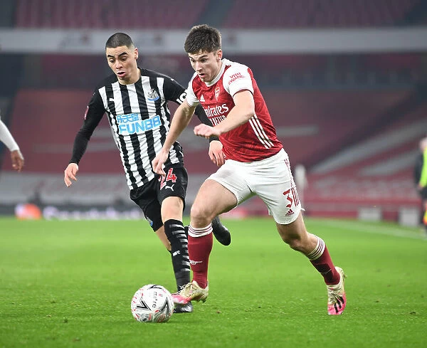 Arsenal's Kieran Tierney Outmaneuvers Newcastle's Miguel Almiron in FA Cup Third Round Clash