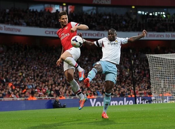 Olivier Giroud (Arsenal) Guy Demel (West Ham). Arsenal 3: 1 West Ham United. Barclays Premier League