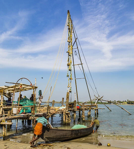 A fishing boat and the Chinese fishing nets at Fort Kochi in Kerala, India