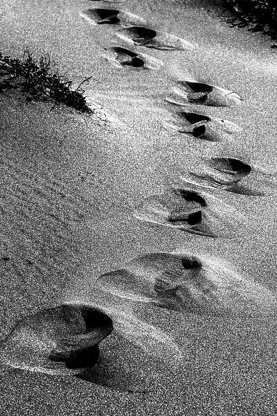 Footsteps in the sand at Playa de Monsul near San Jose in Spain