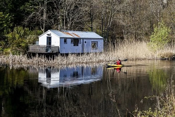 A kayaker on the Crinan Canal, Argyll & Bute, Scotland