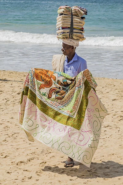 A salesman looking for customers at the resort of Kovalam in Kerala, India